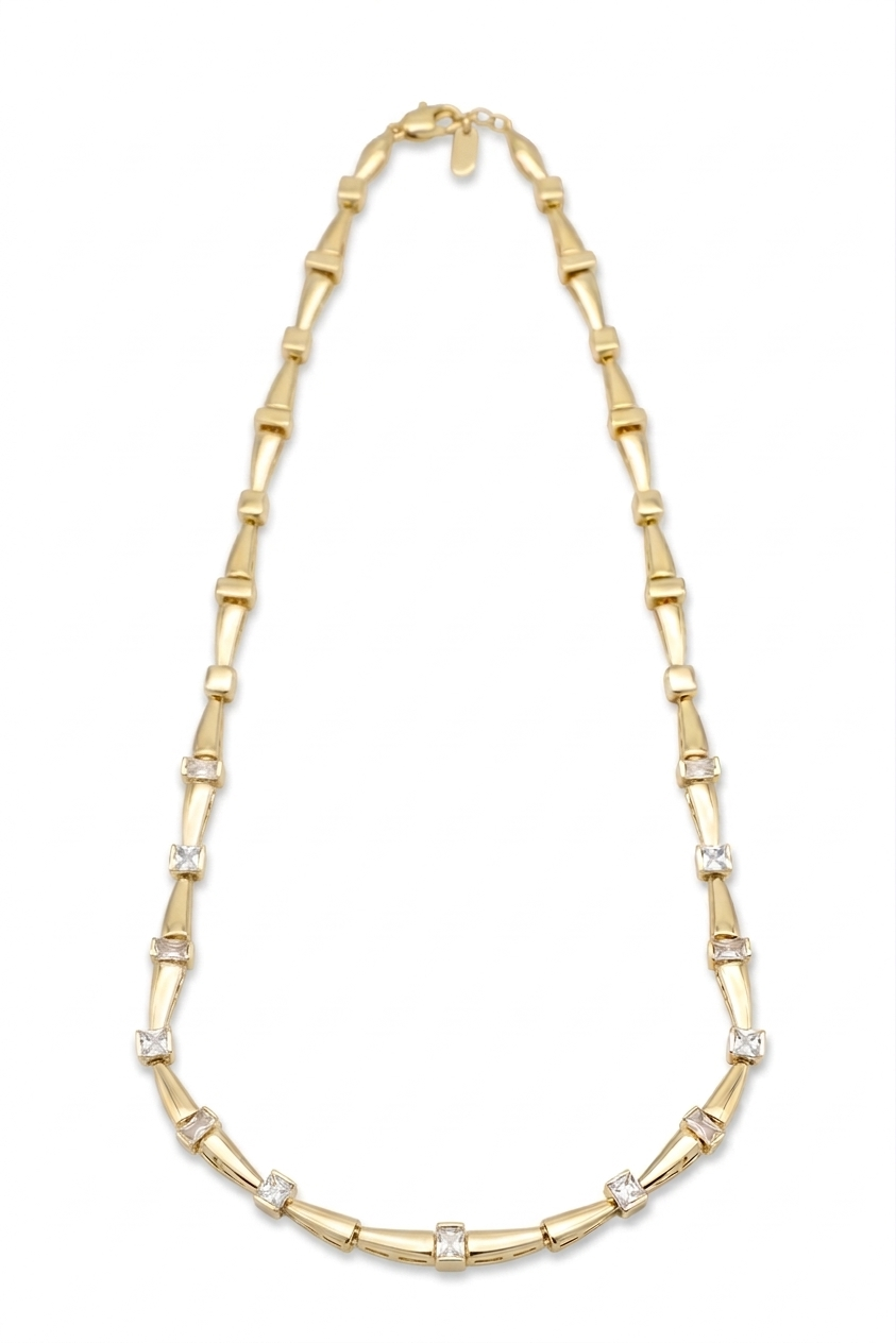 Gold necklace with bamboo-style links on a white background