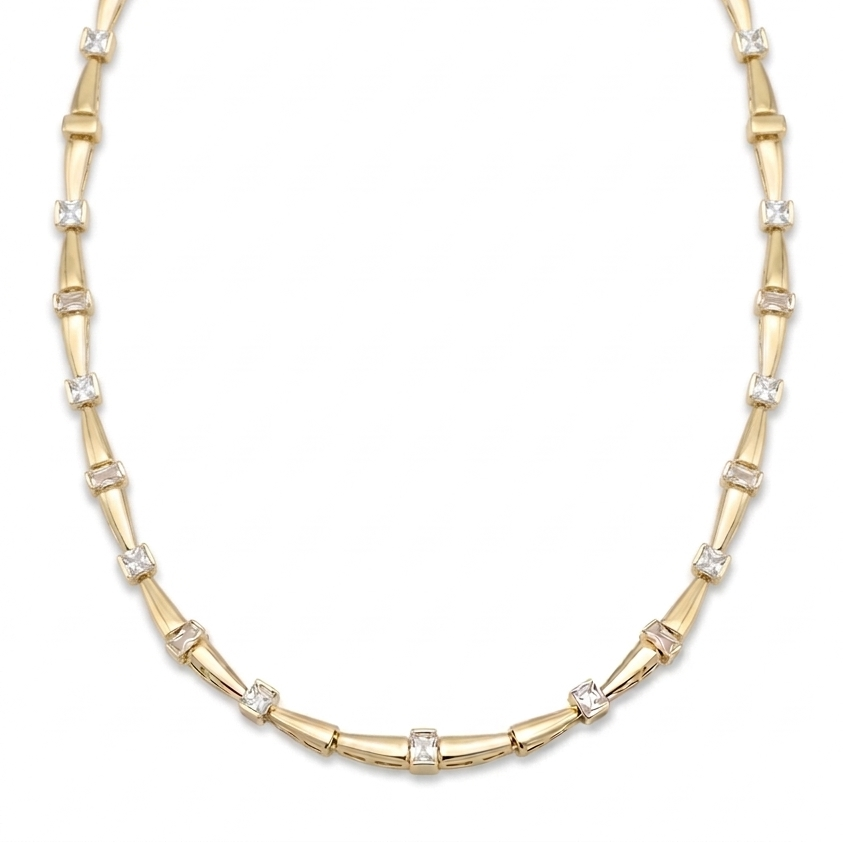 Gold necklace with bamboo design on a white background