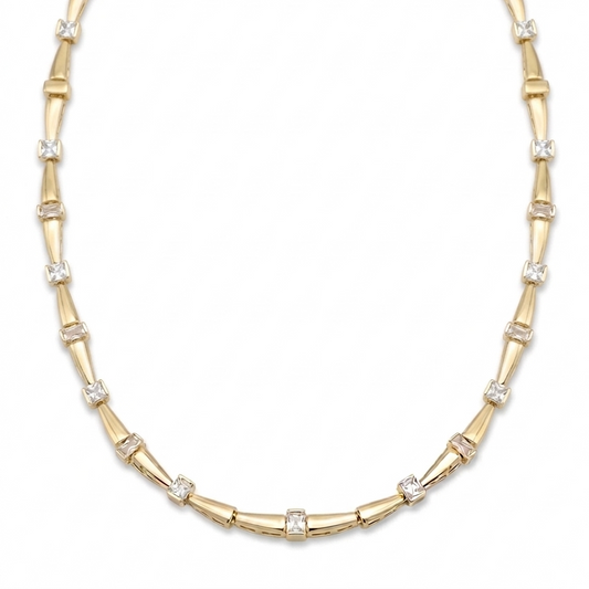 Gold necklace with bamboo design on a white background